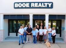 Employees of Booe Realty standing outside their office building